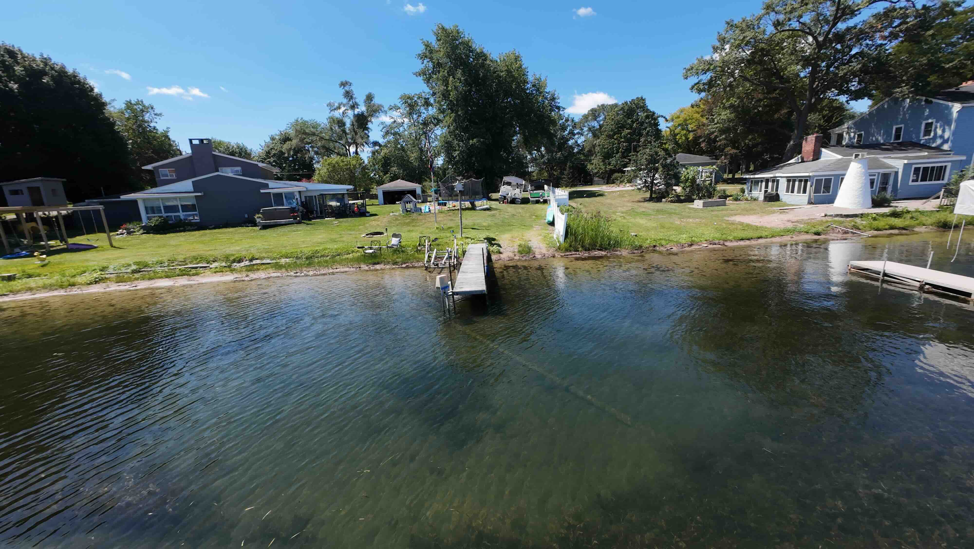 Private Fonda Lake and the sandy-bottom dock, steps from the house