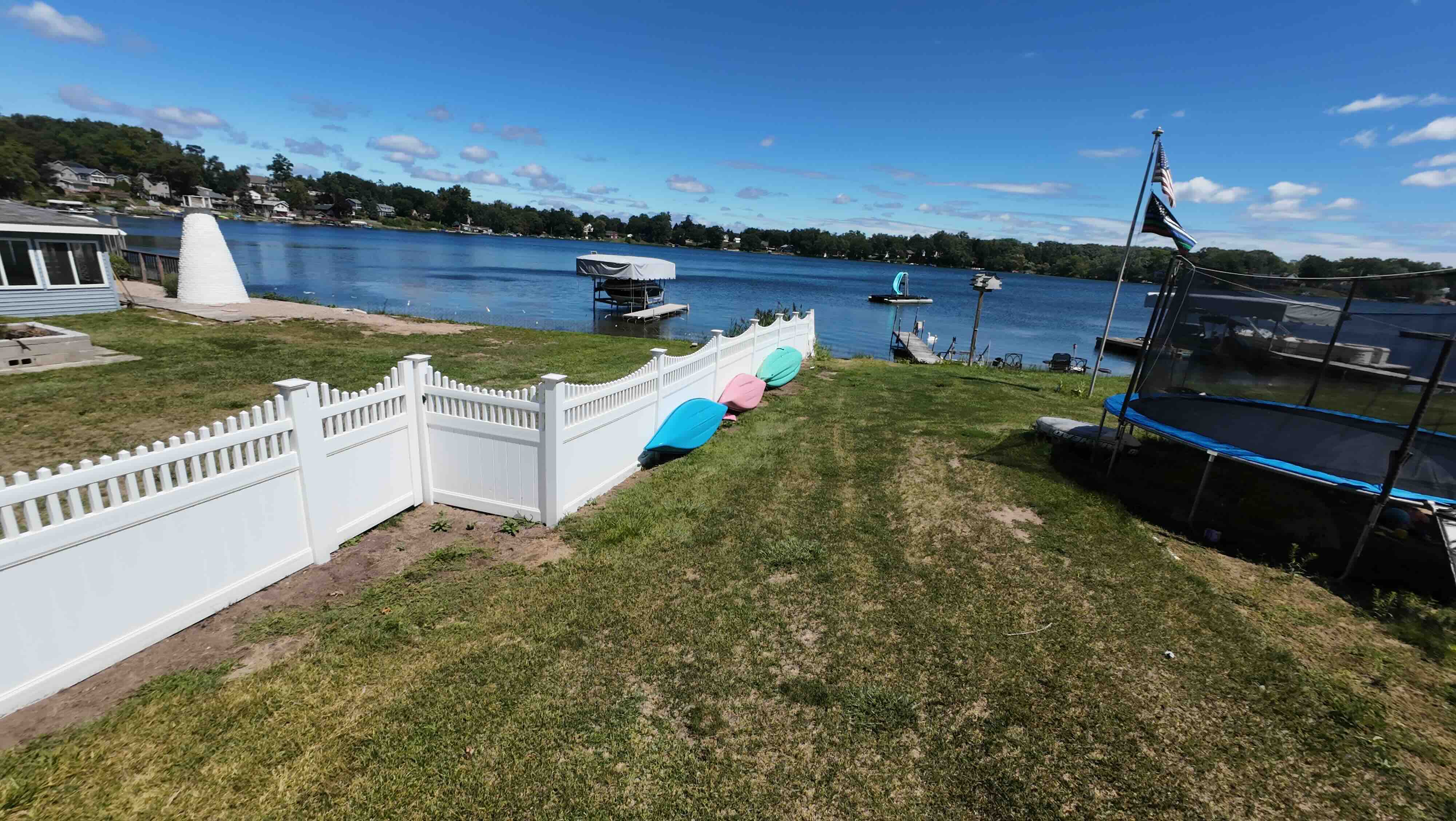 Two kayaks, a paddleboard and a pedal boat out front, free for guests to use